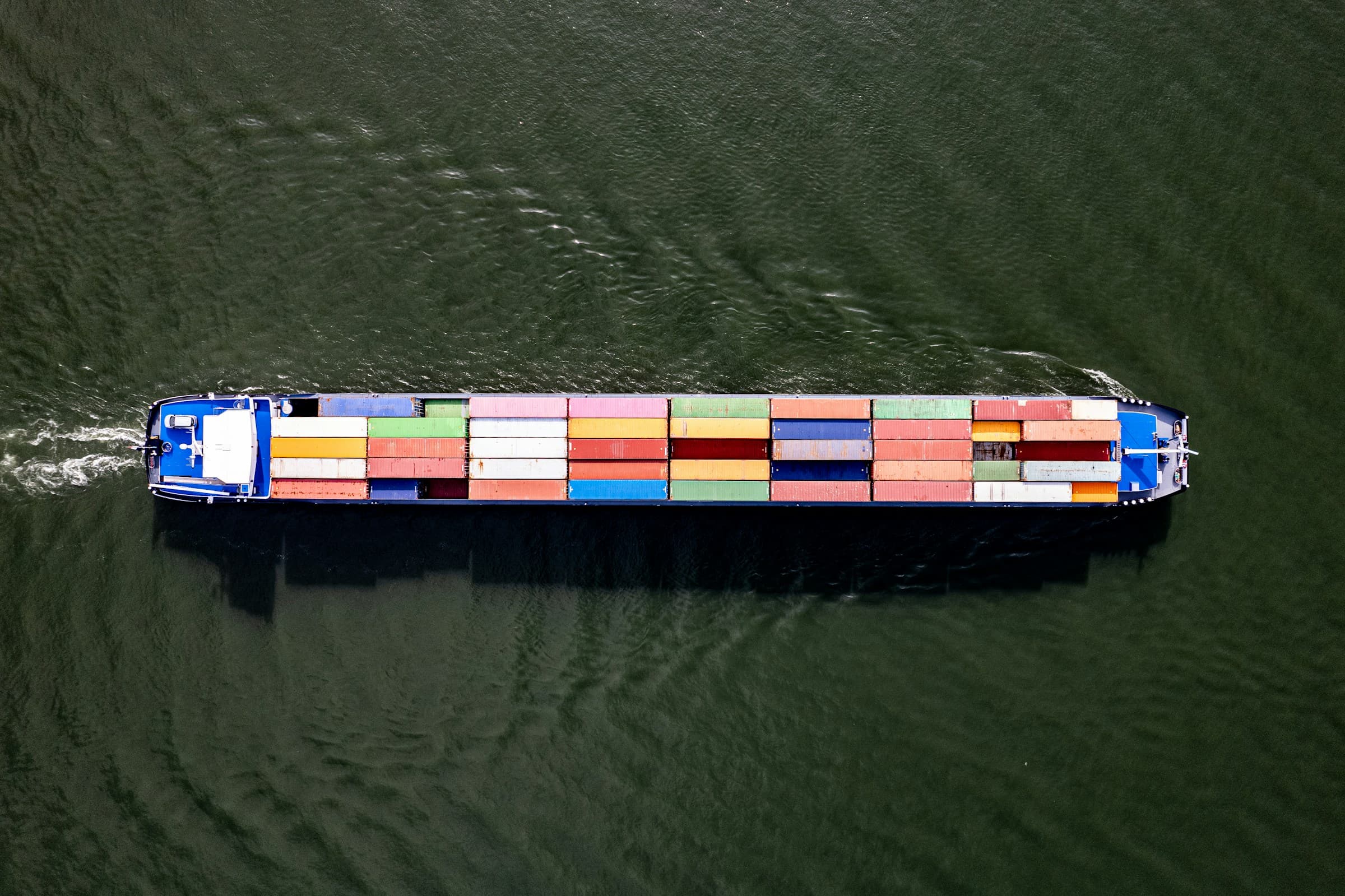 Container barge loaded with shipping containers, seen from directly above