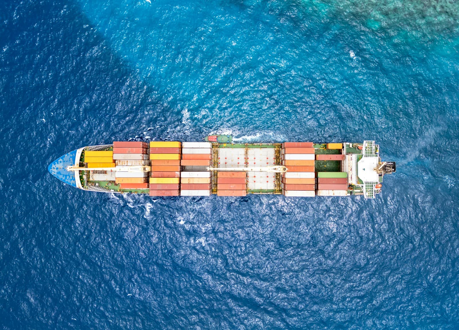 Container ship at sea seen from above